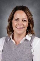 Picture of a woman with a grey vest
